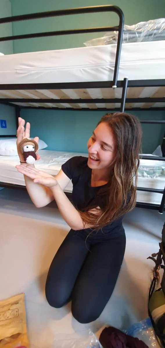Customer holding a Tiny Pilgrim doll